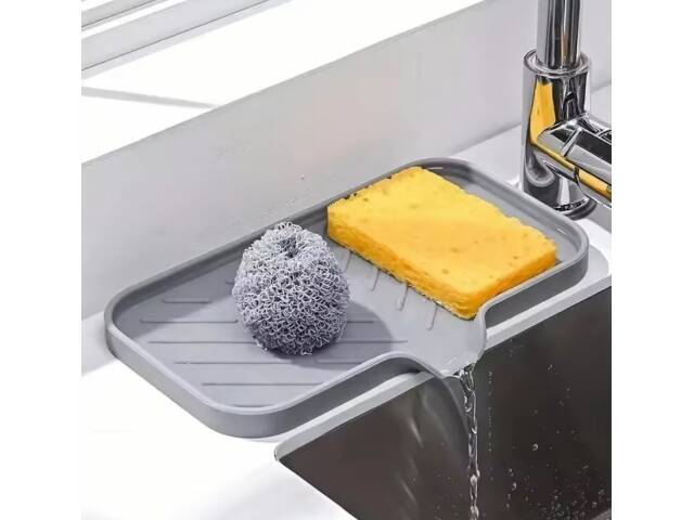 Alfombrilla de silicona anti salpicaduras para canilla con drenaje de agua ideal para mesada de cocina y baño.