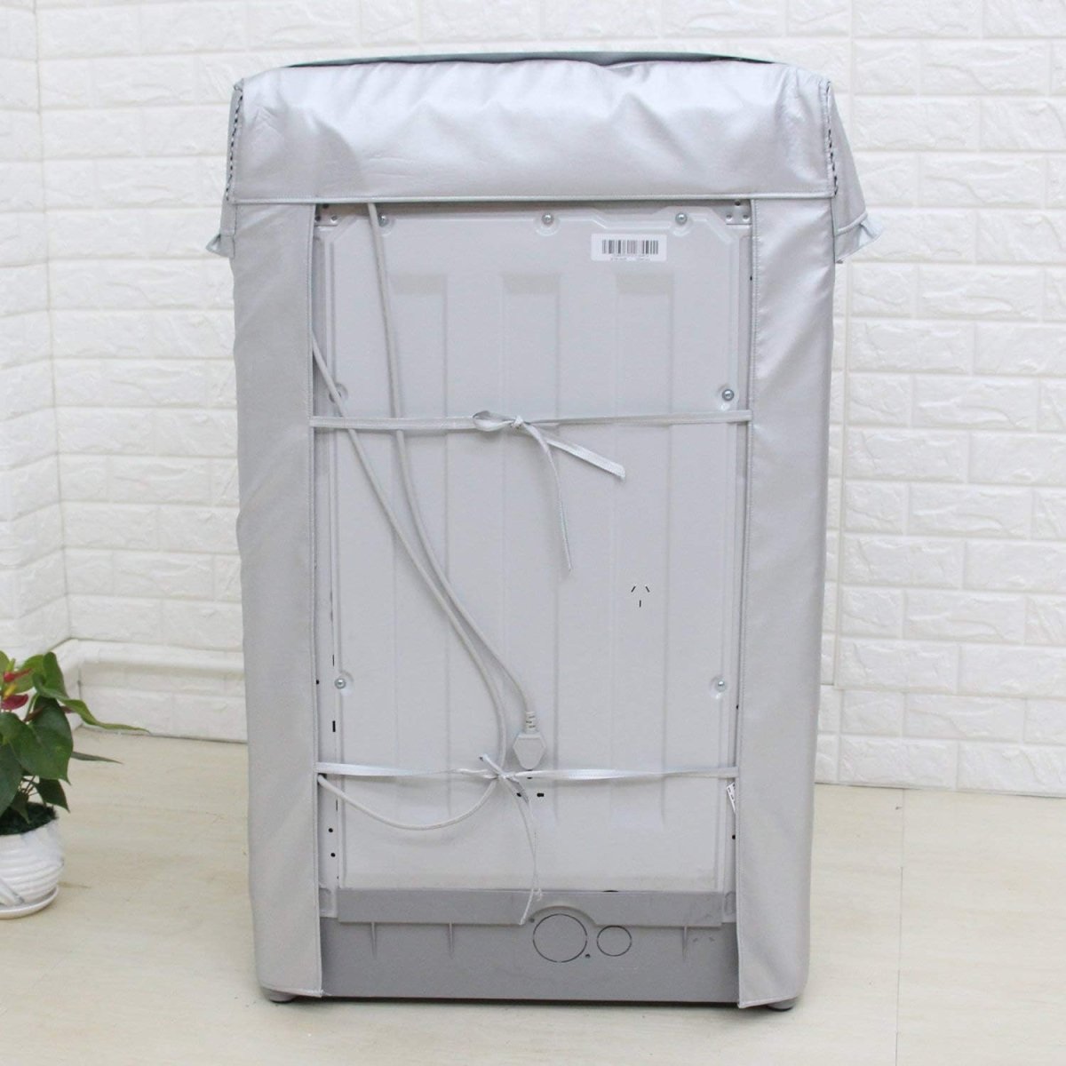 Funda para lavarropas carga superior impermeable color plata para proteger de polvo y agua en balcones y exteriores.