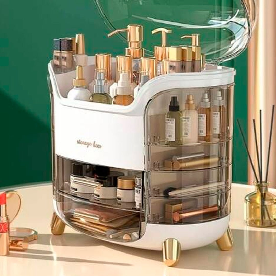 Organizador de cosméticos con tapa transparente y múltiples compartimentos para maquillaje, perfumes y productos de belleza.