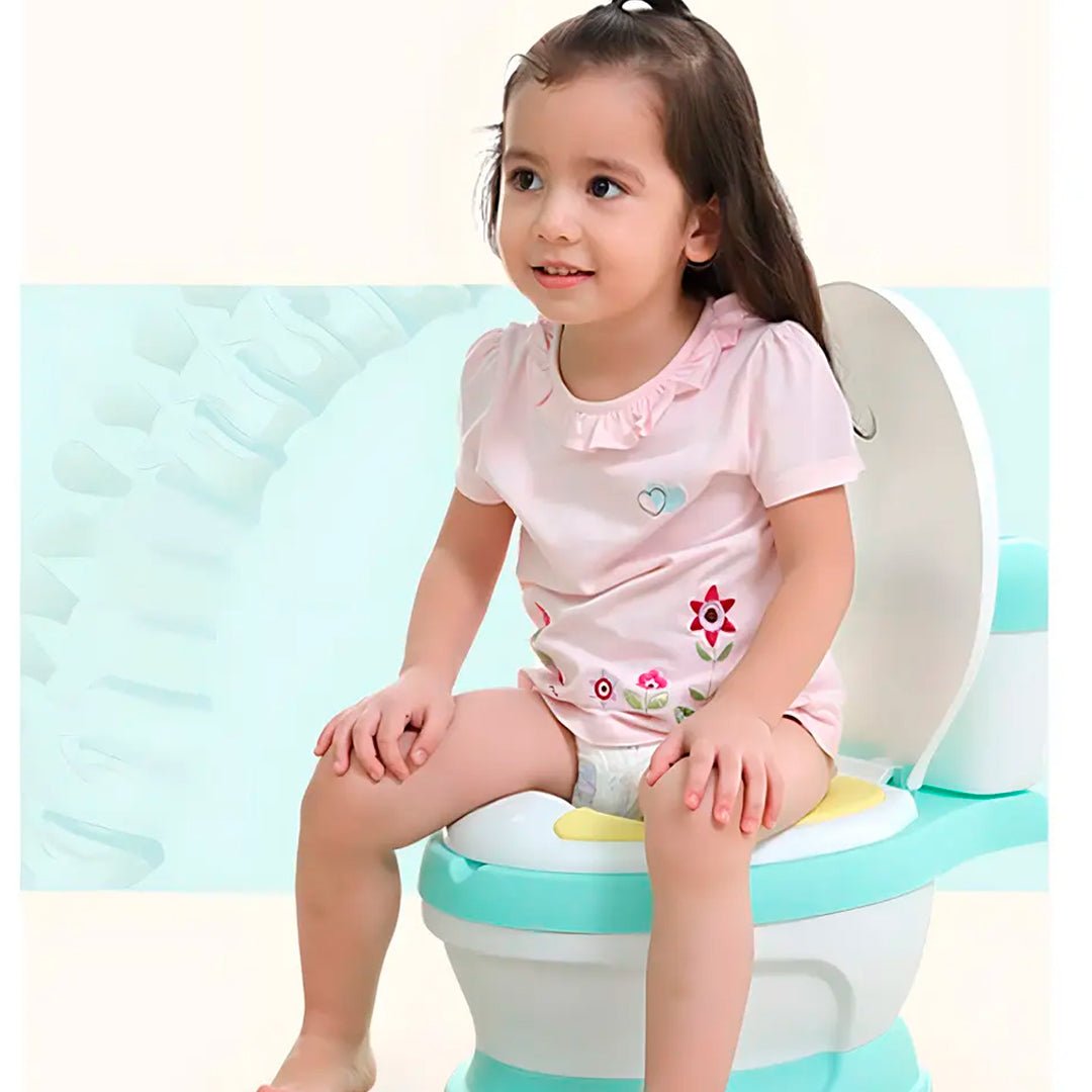 Inodoro infantil de entrenamiento con asiento acolchado, recipiente extraíble y base antideslizante para niños.